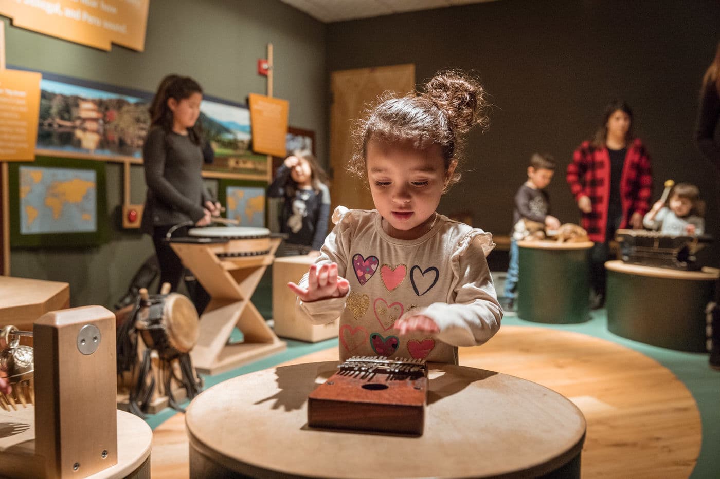 Kids in the PlayLab make music (or joyful noise) with instruments from around the world.