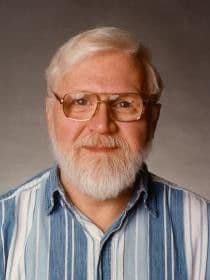 A man with white hair and a beard