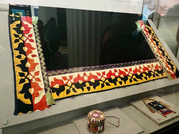 Photo 1 case with Madeline BigBear’s quilled and beaded bag, Photo 2 Eli pointing out Colin Wesaw in the photo of the Chicago Canoe Club, Video 1 Horse dance (by Menominee woodland dancer) Video 2 basket dance (Diné) #NativeVoicesNativeStories fieldmuseum