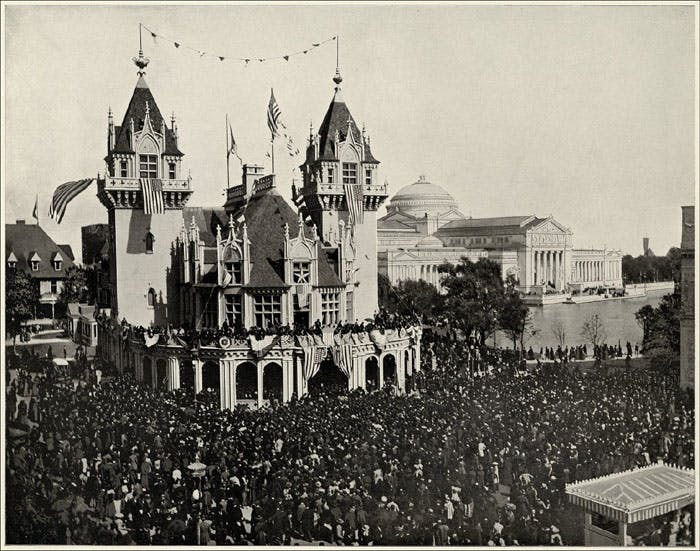 A huge crowd stands outside the Indiana Building at the Columbian Exposition, Chicago, 1893. The Palace of Fine Arts building is in the background.